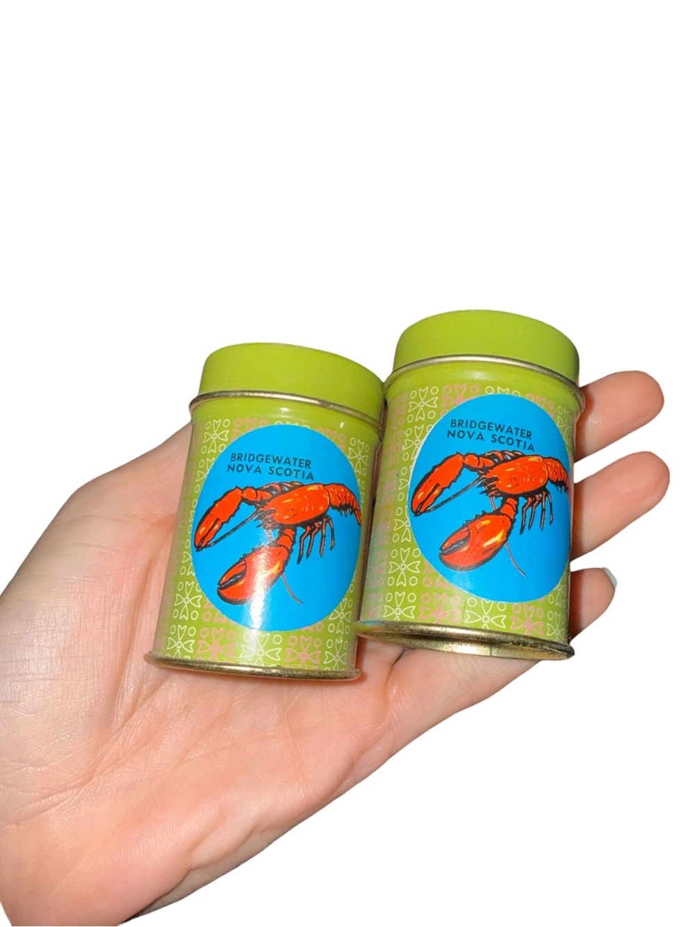 Vintage tin salt and pepper shakers with lobster stickers